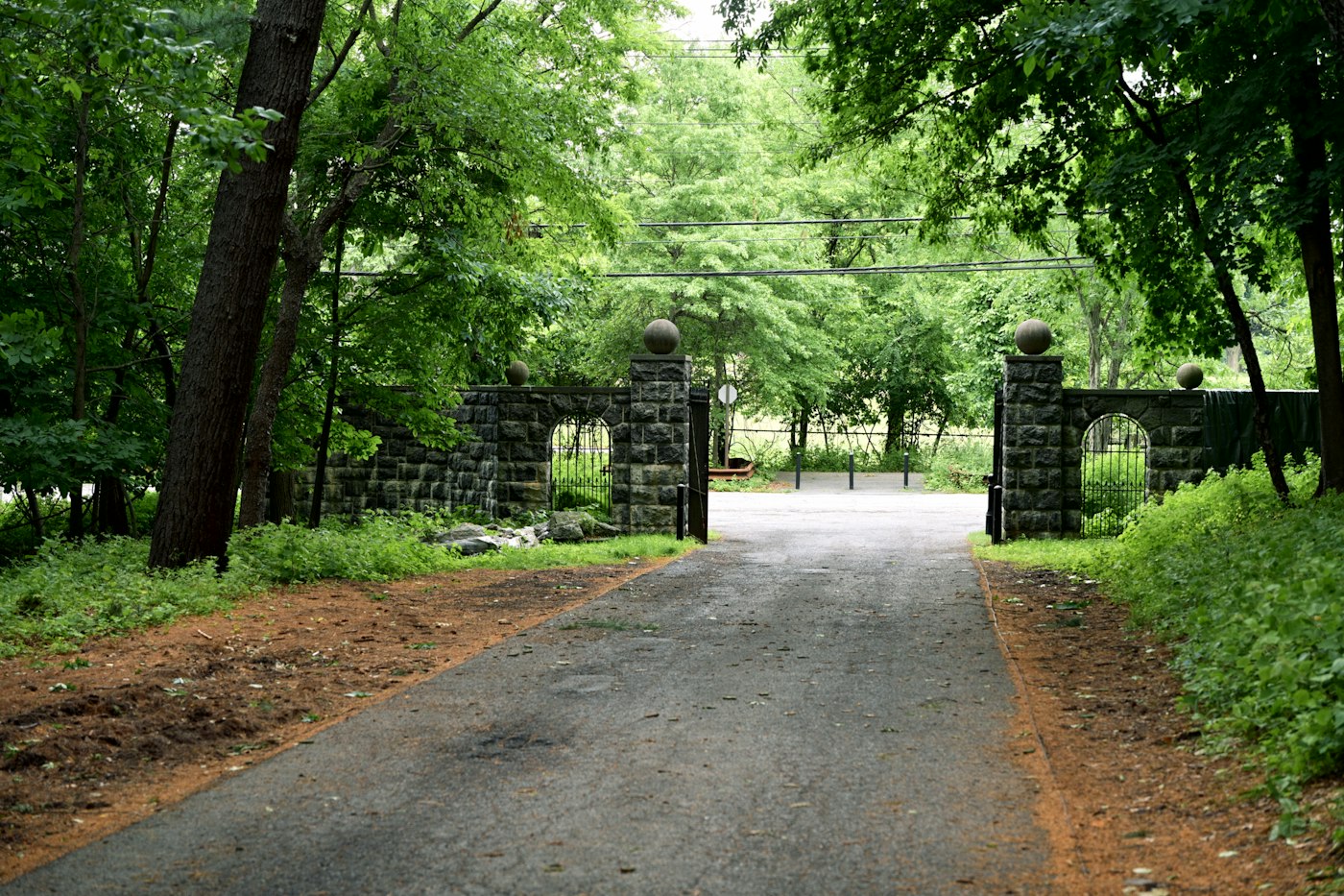 Stone gate pillars on a wooded drive (example photo)