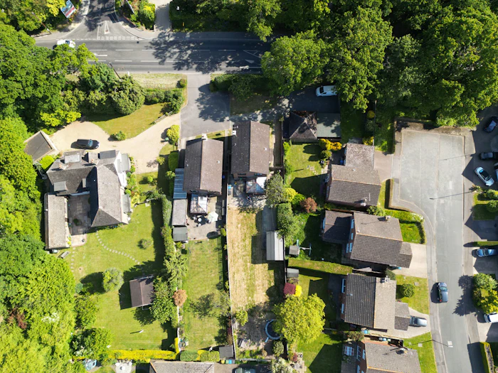 An aerial view of houses set among mature trees