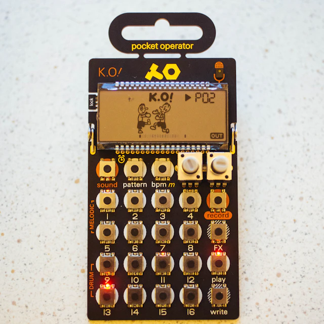 Black Pocket Operator K.O. synthesizer displaying k.o! on its screen