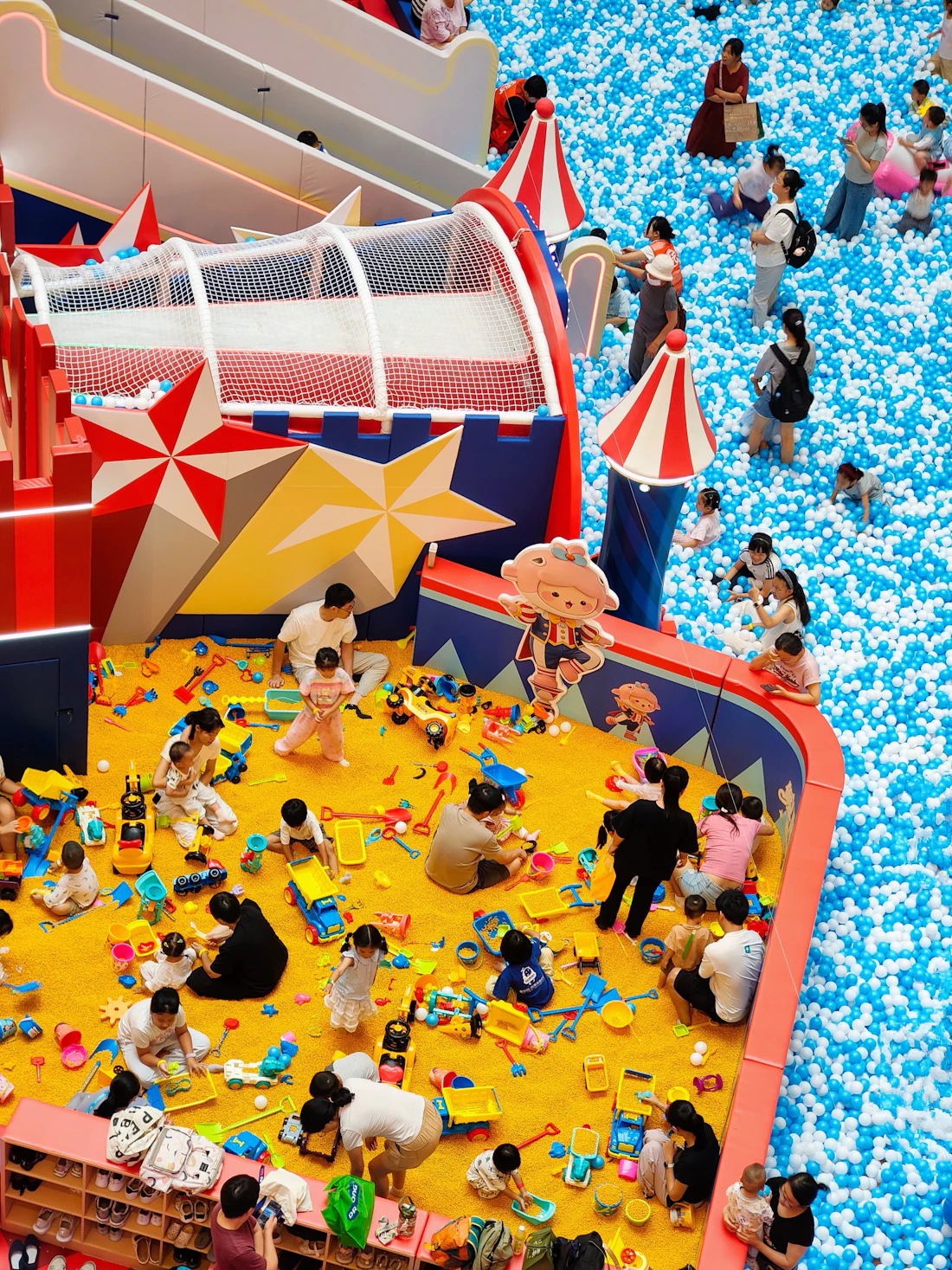 Children playing together in a bright indoor play space