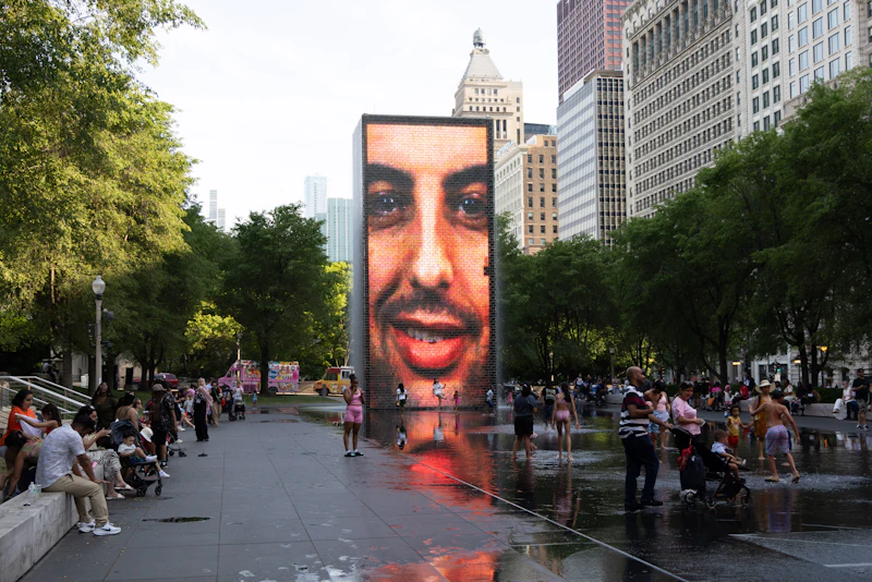 Families enjoying the Crown Fountain video screens at Millennium Park