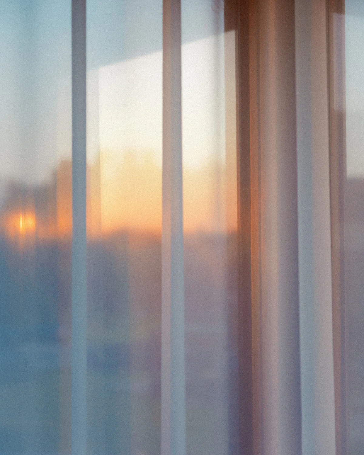 Soft morning light through a sheer curtain — a lighter, calmer moment