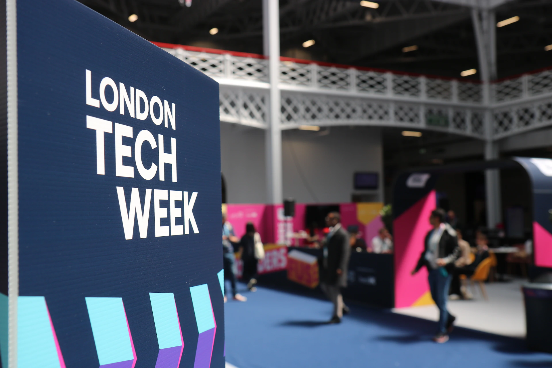 London tech week sign at an indoor exhibition.