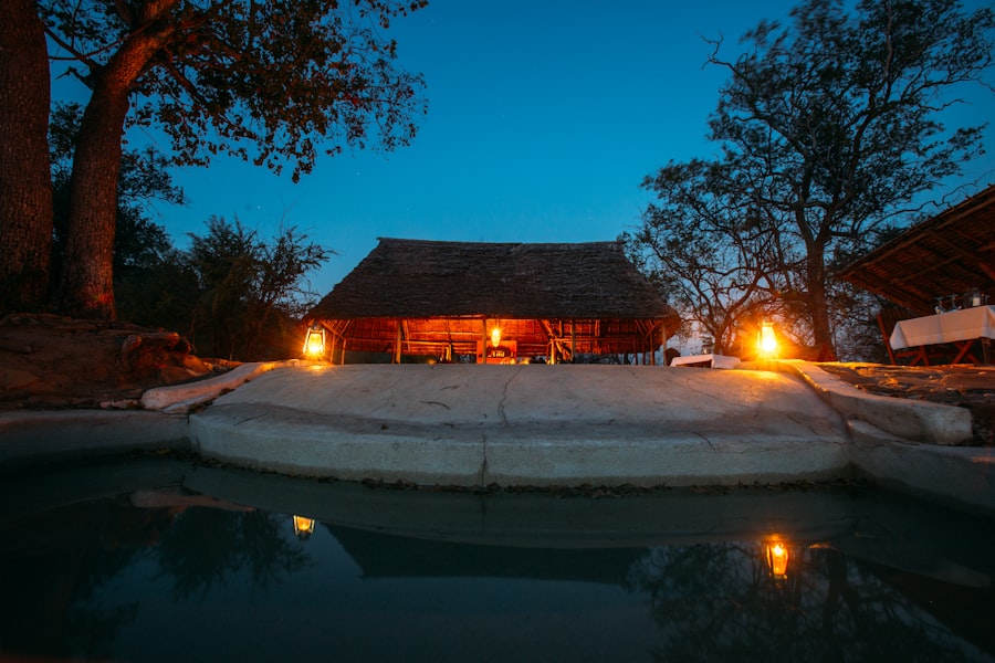 Private safari lodge and pool illuminated at dusk