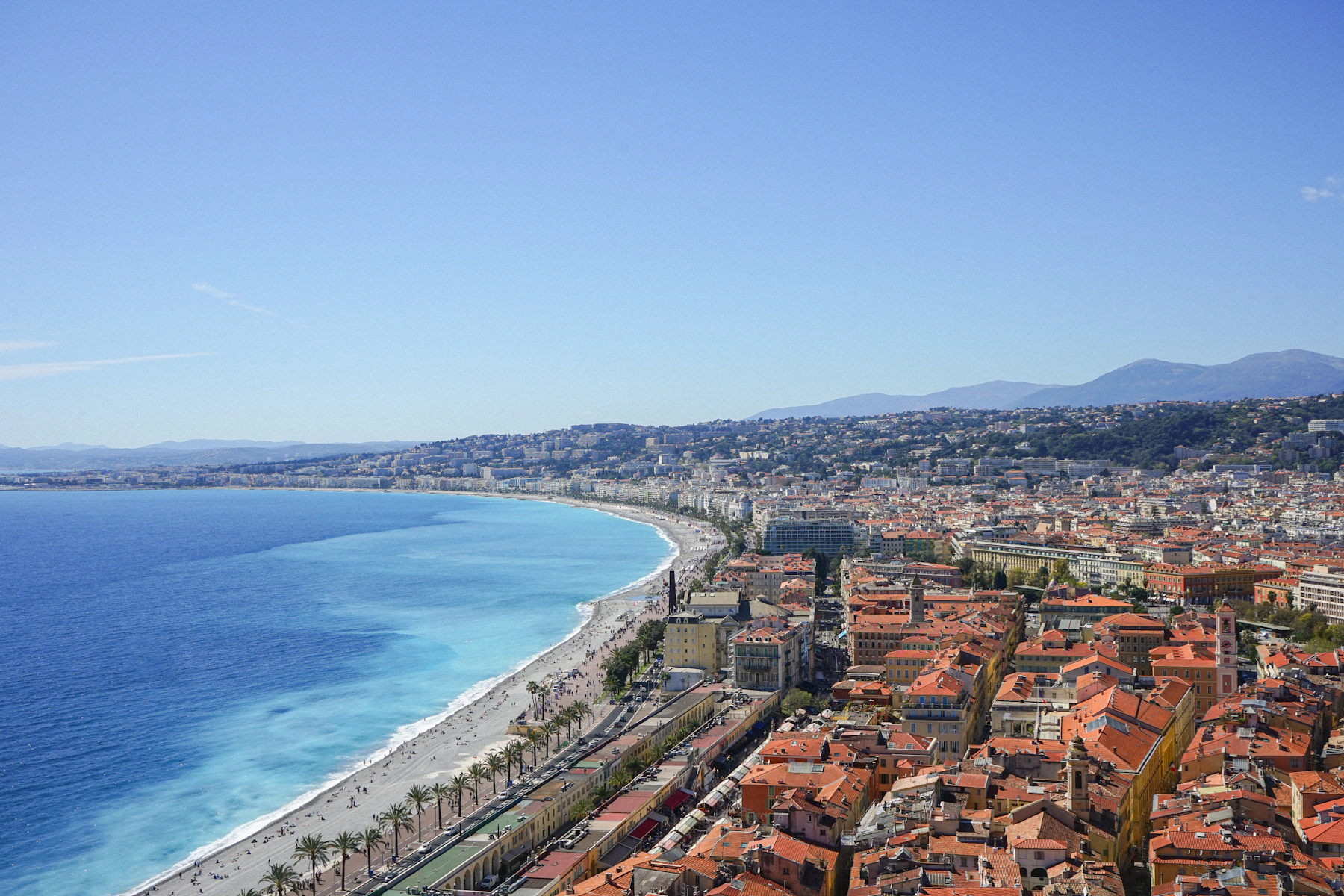 Premium Mediterranean coastal destination with blue water and elegant cityscape