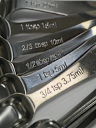 Stainless steel measuring spoons with engraved measurements