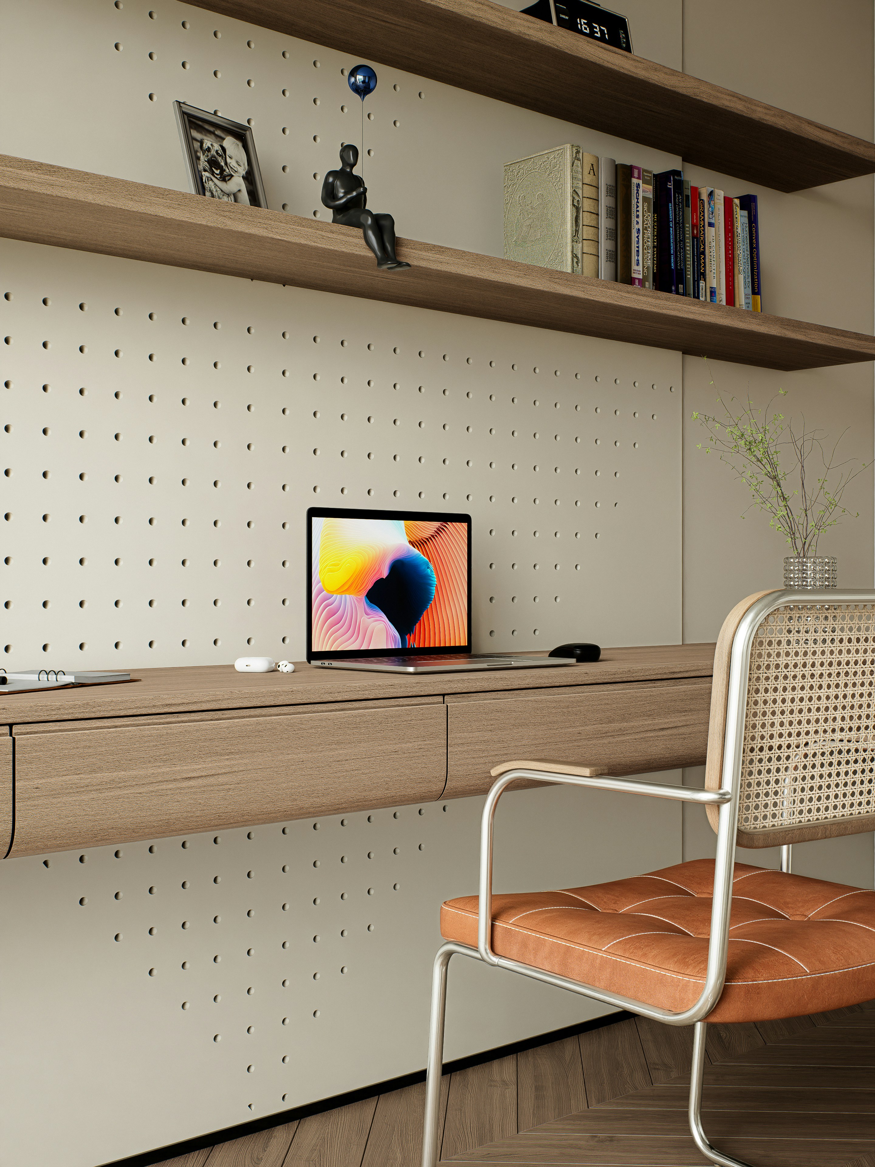 Modern home office with laptop, wooden desk, and stylish chair.