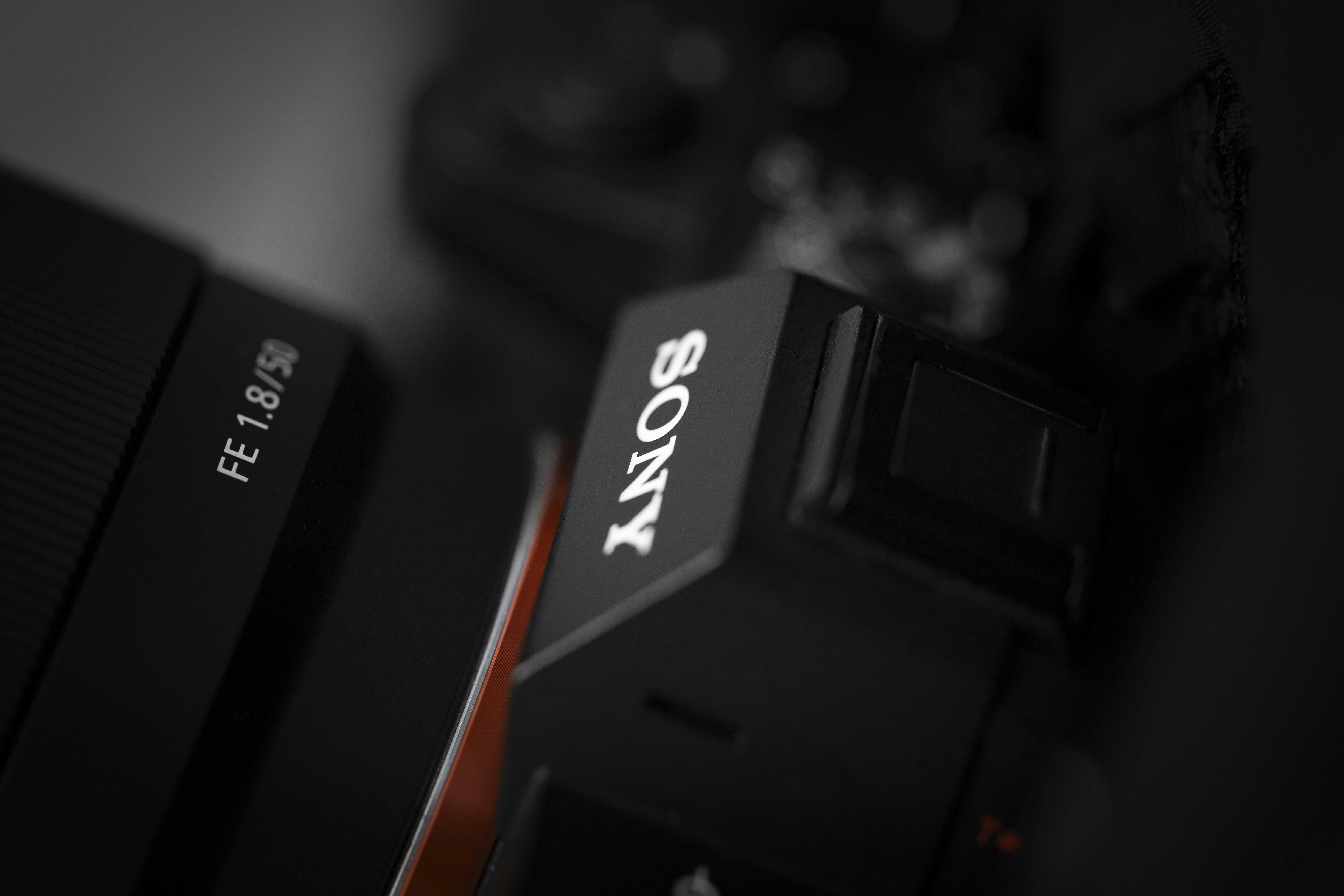 Sony noise canceling earbuds close up - Sony camera body with an fe 1.8/50 lens.