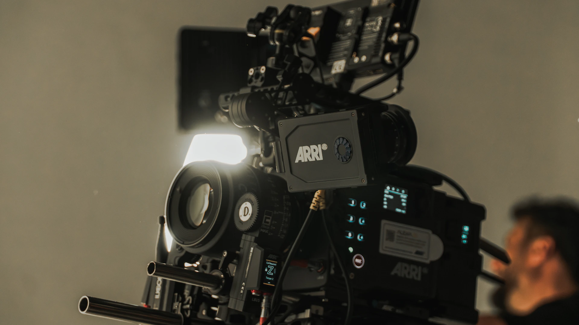 A professional arri video camera with a bright light