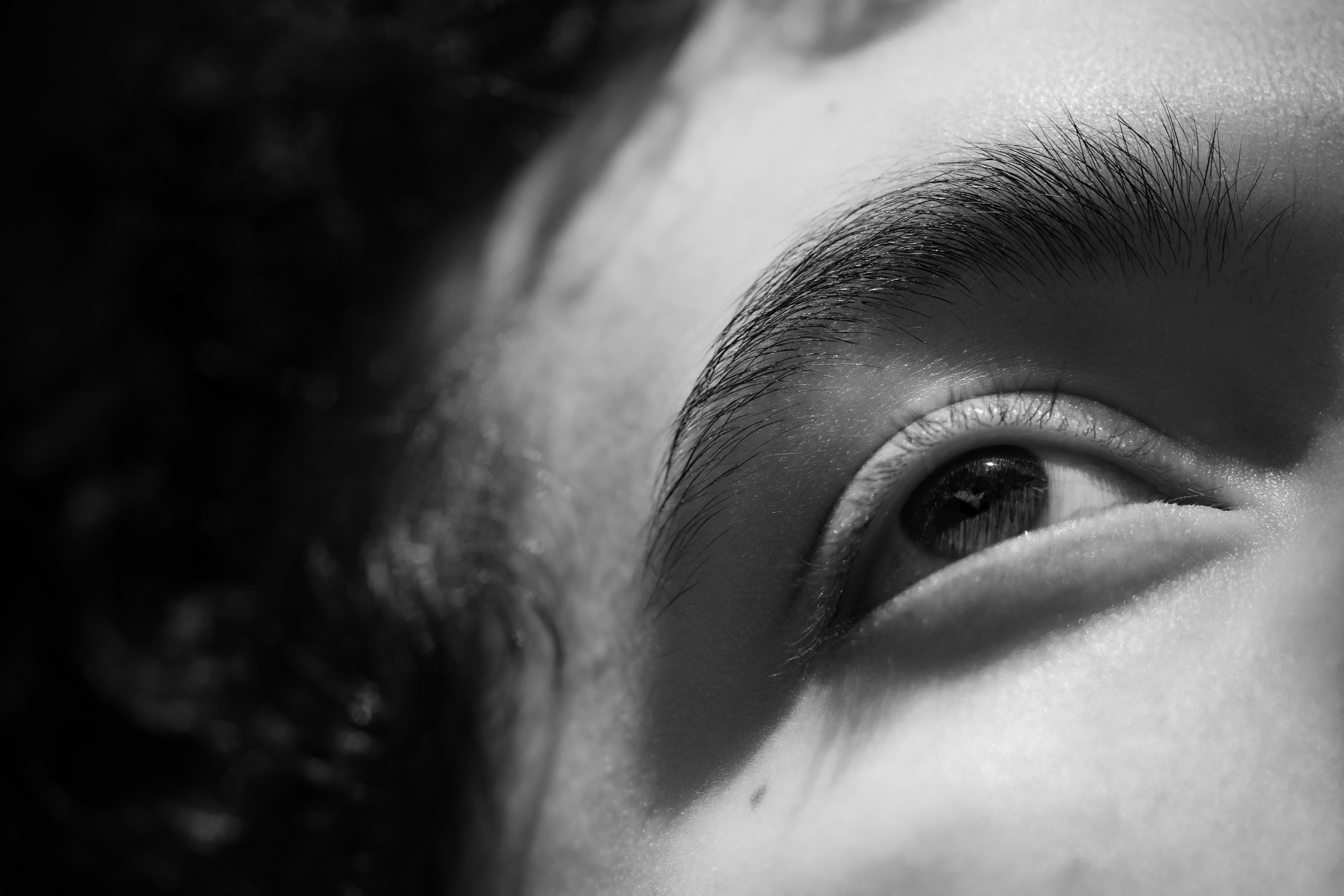 Close-up of a person's eye in black and white