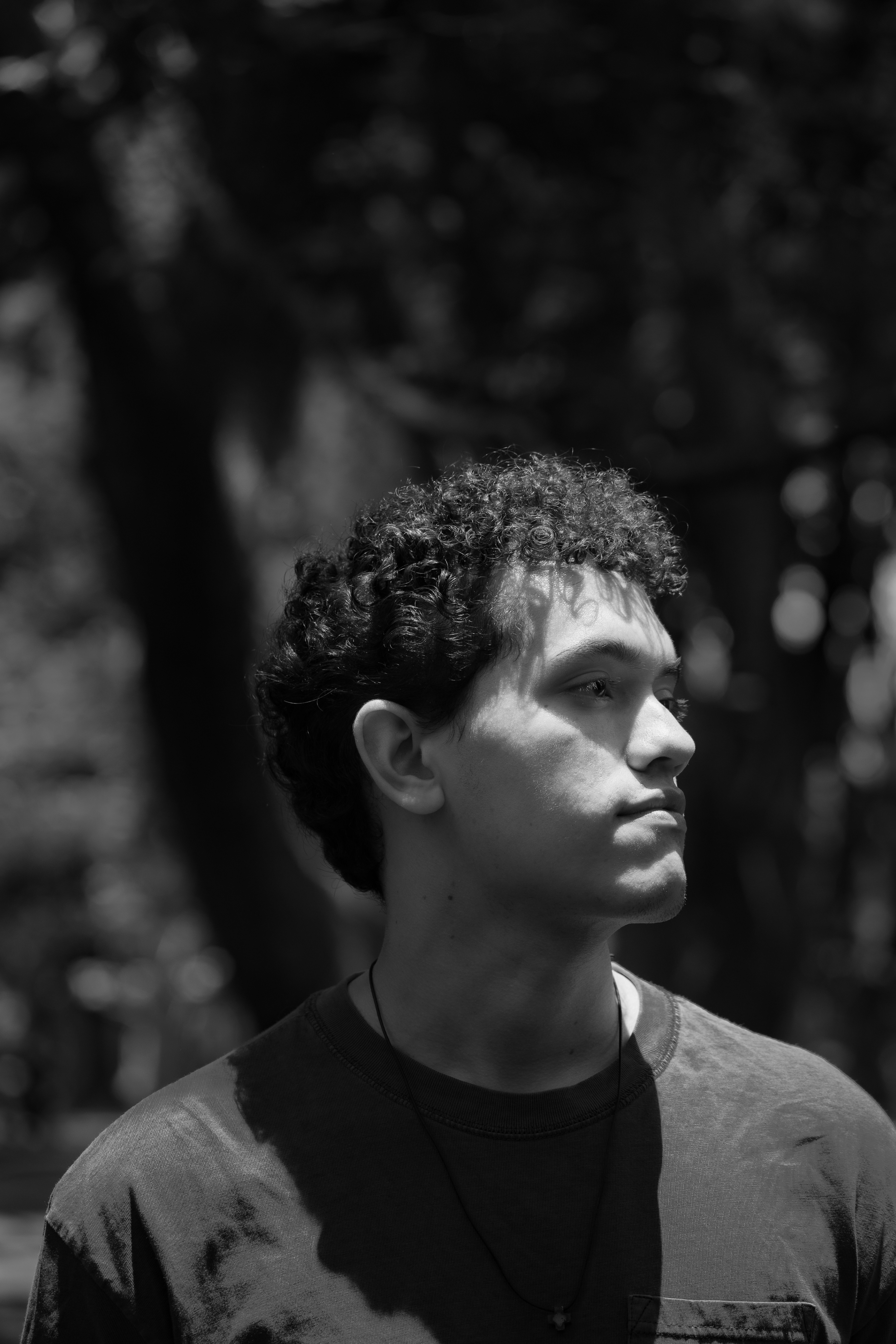 Black and white of a young man with curly hair