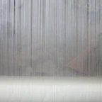 Abstract grey background with vertical lines and horizontal surface.
