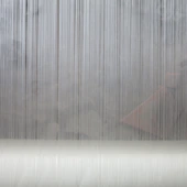 Abstract grey background with vertical lines and horizontal surface.