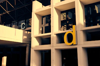 Modern building facade with large letters c and d