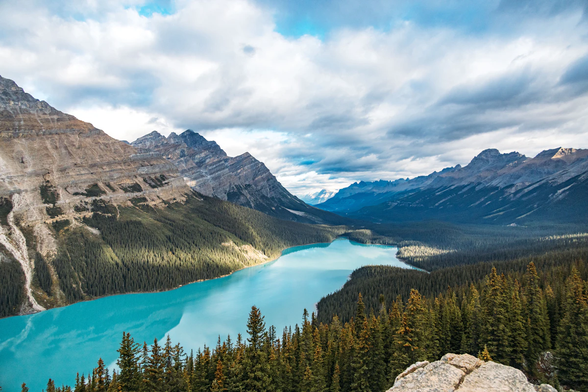 A turquoise glacial lake surrounded by the peaks of Banff National Park, Alberta, Canada