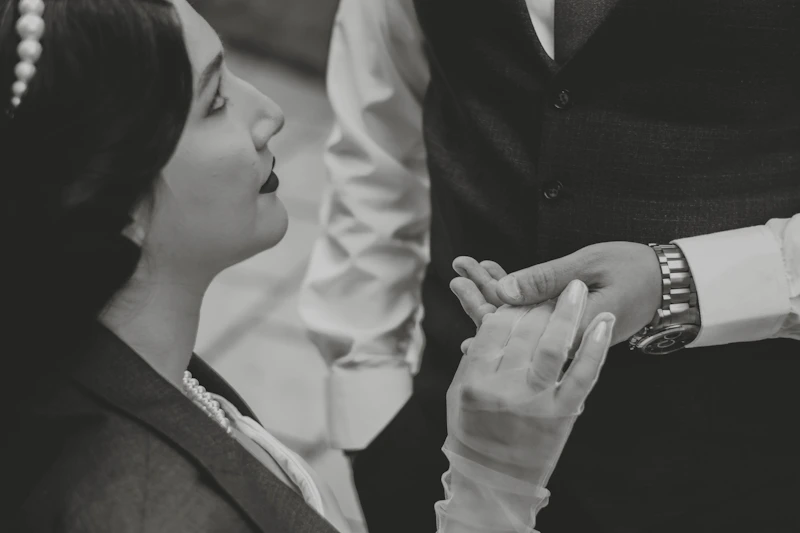 elegant woman holding her partner's hand