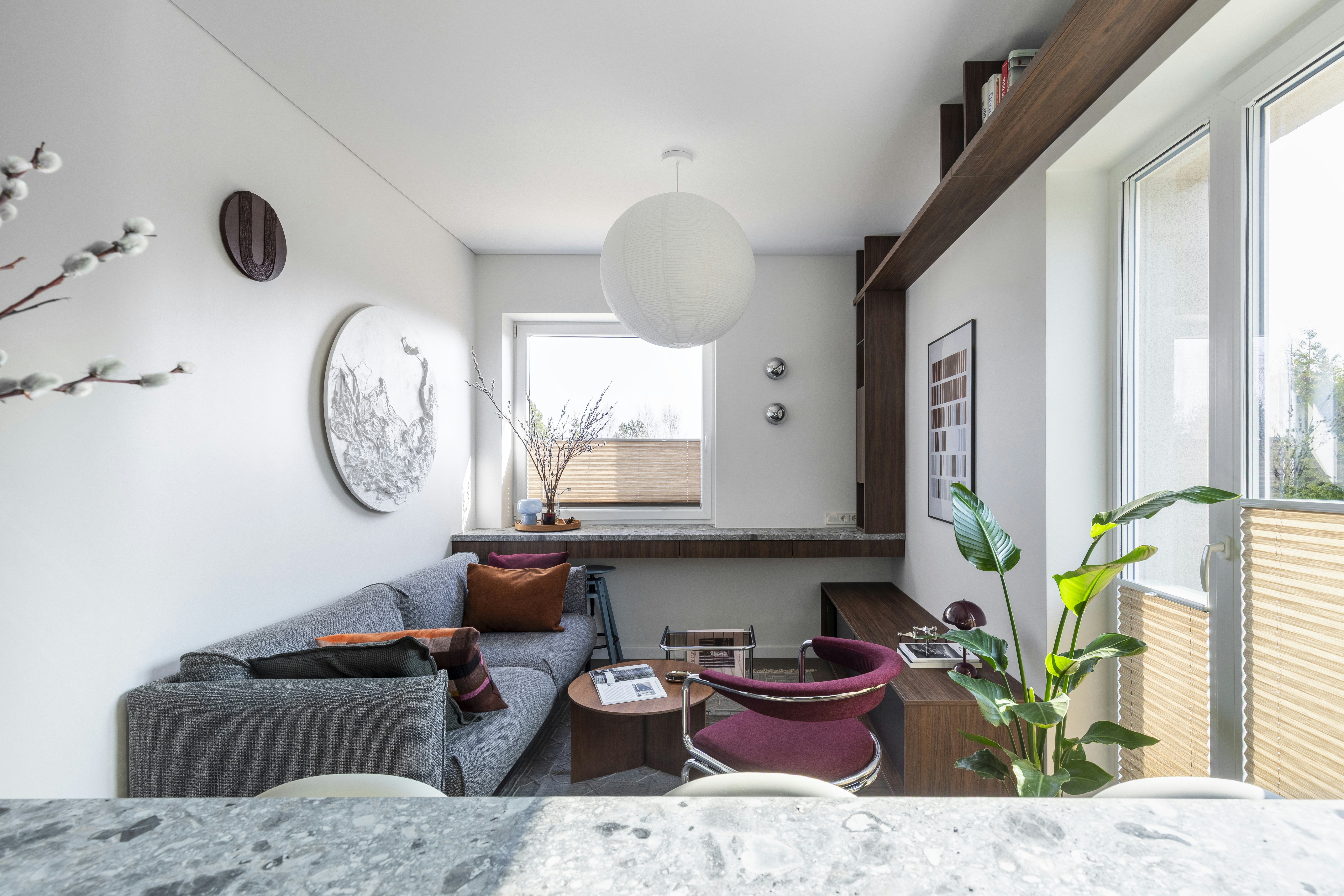 This 35 m² apartment in Vilnius is designed as a compact yet spatially fluid living environment, drawing on Mid-Century modern principles interpreted through a contemporary lens.