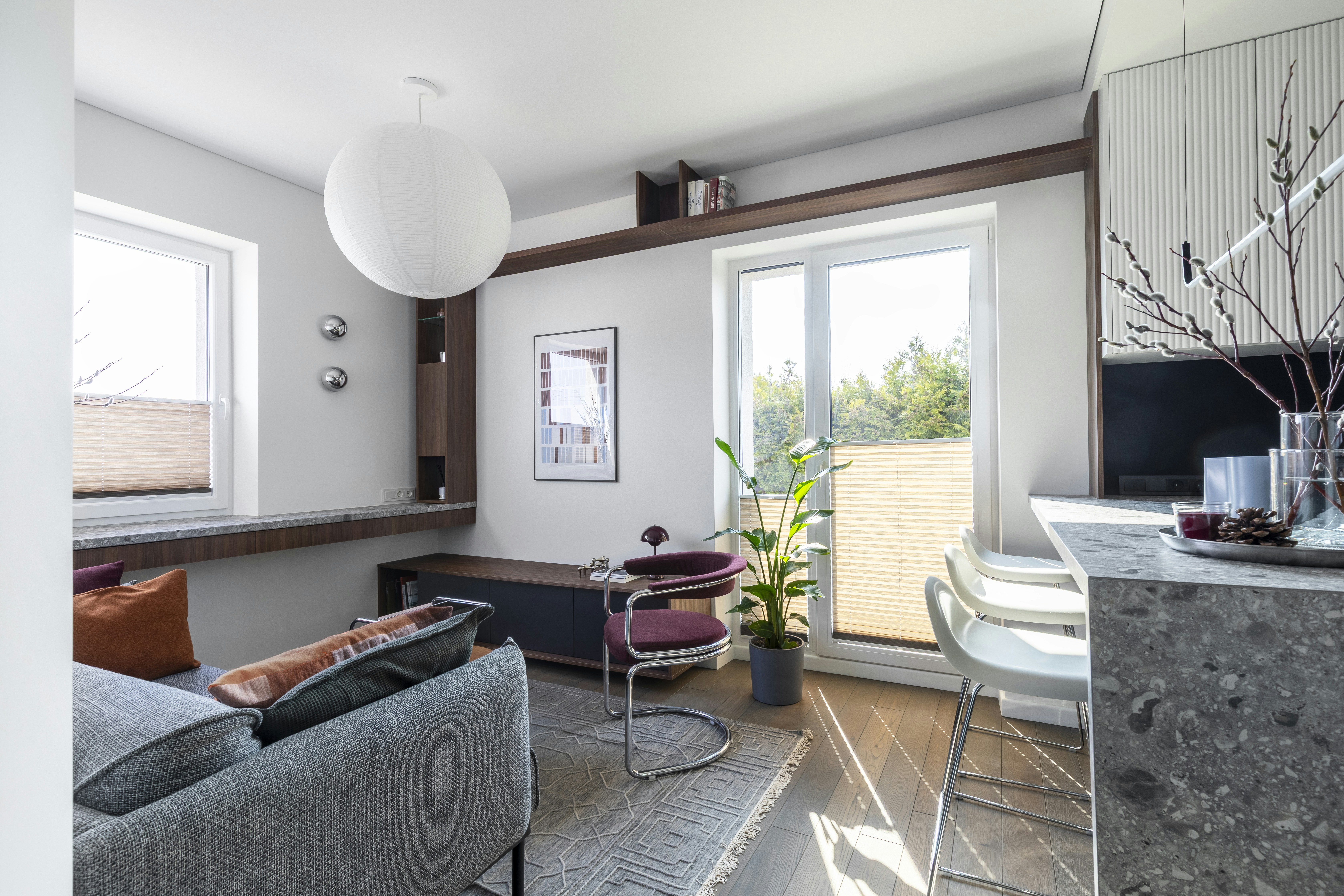 This 35 m² apartment in Vilnius is designed as a compact yet spatially fluid living environment, drawing on Mid-Century modern principles interpreted through a contemporary lens.