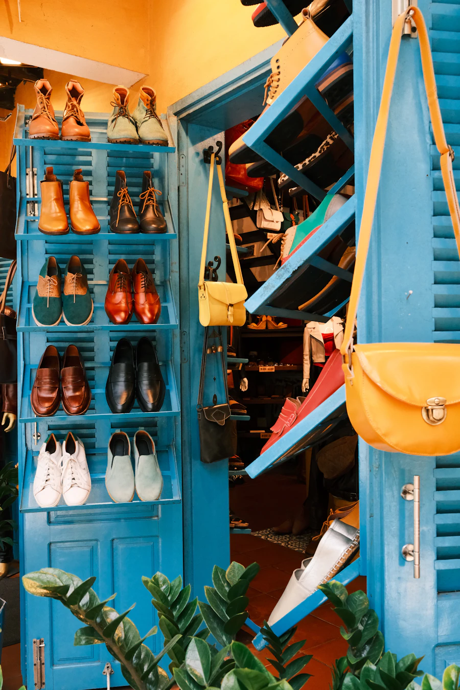 Colorful shoes and handbags on blue shelves