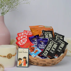 A chocolate gift basket, card, and candle