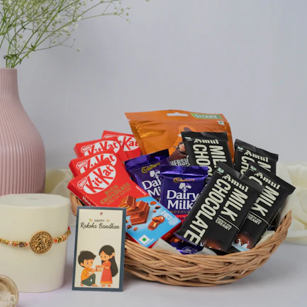 A chocolate gift basket, card, and candle.