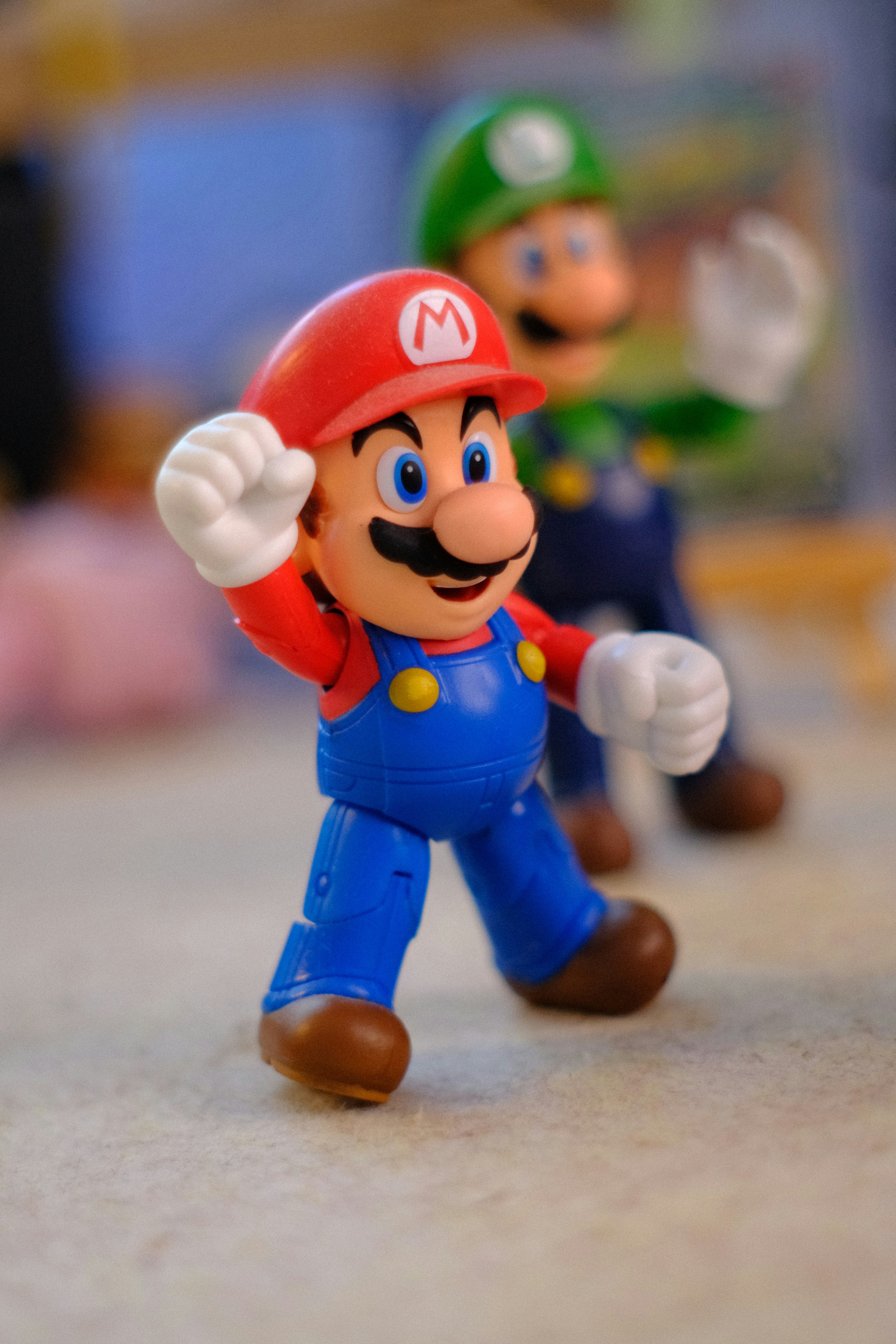 Mario and luigi action figures standing together.