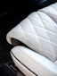 White quilted perforated car seat interior.