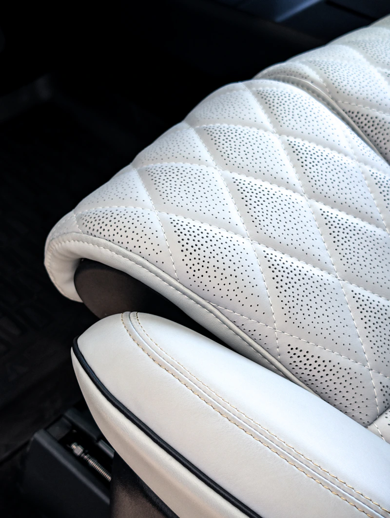 Close-up of a quilted, perforated seat