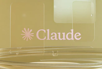 Pink claude logo on a golden background with clear elements.