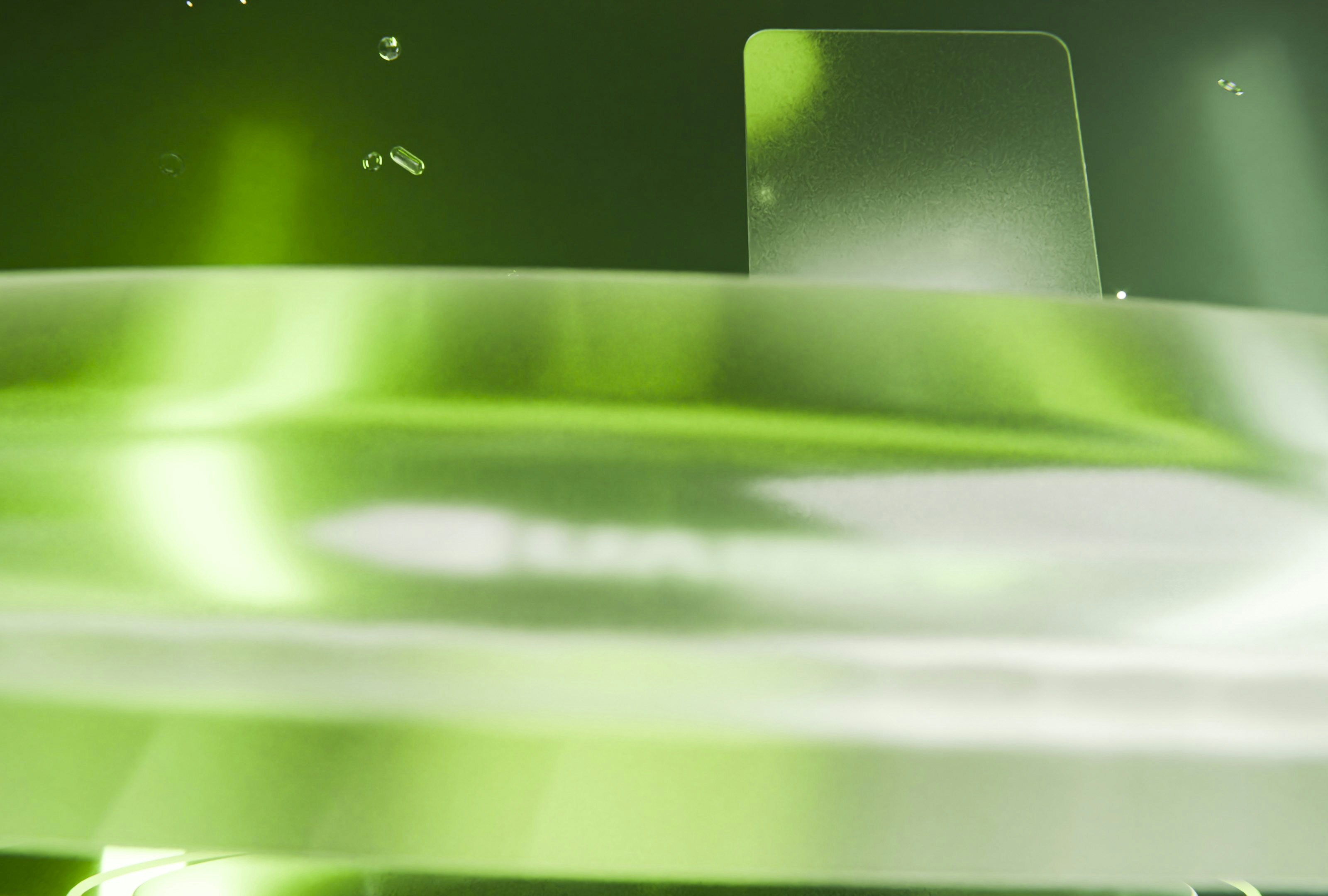 Abstract green and white background with blurred lines and reflections