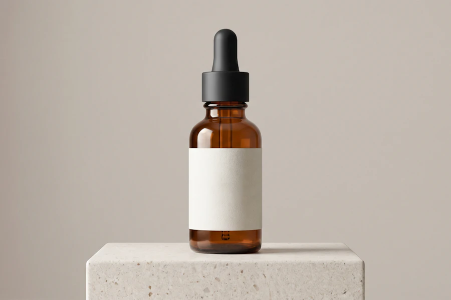 Amber glass dropper bottle with blank label on concrete block
