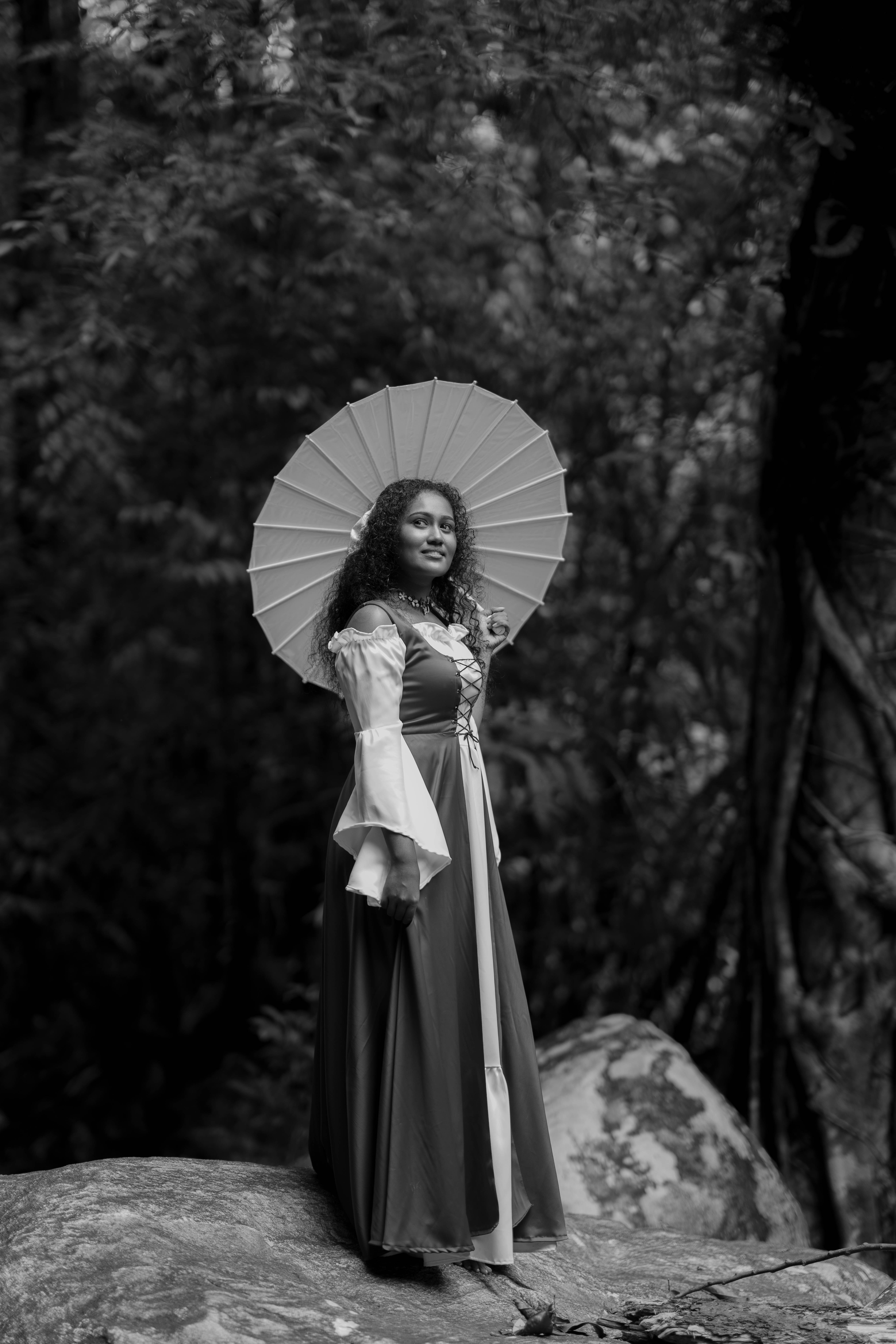 Vintage-style long dress with umbrella