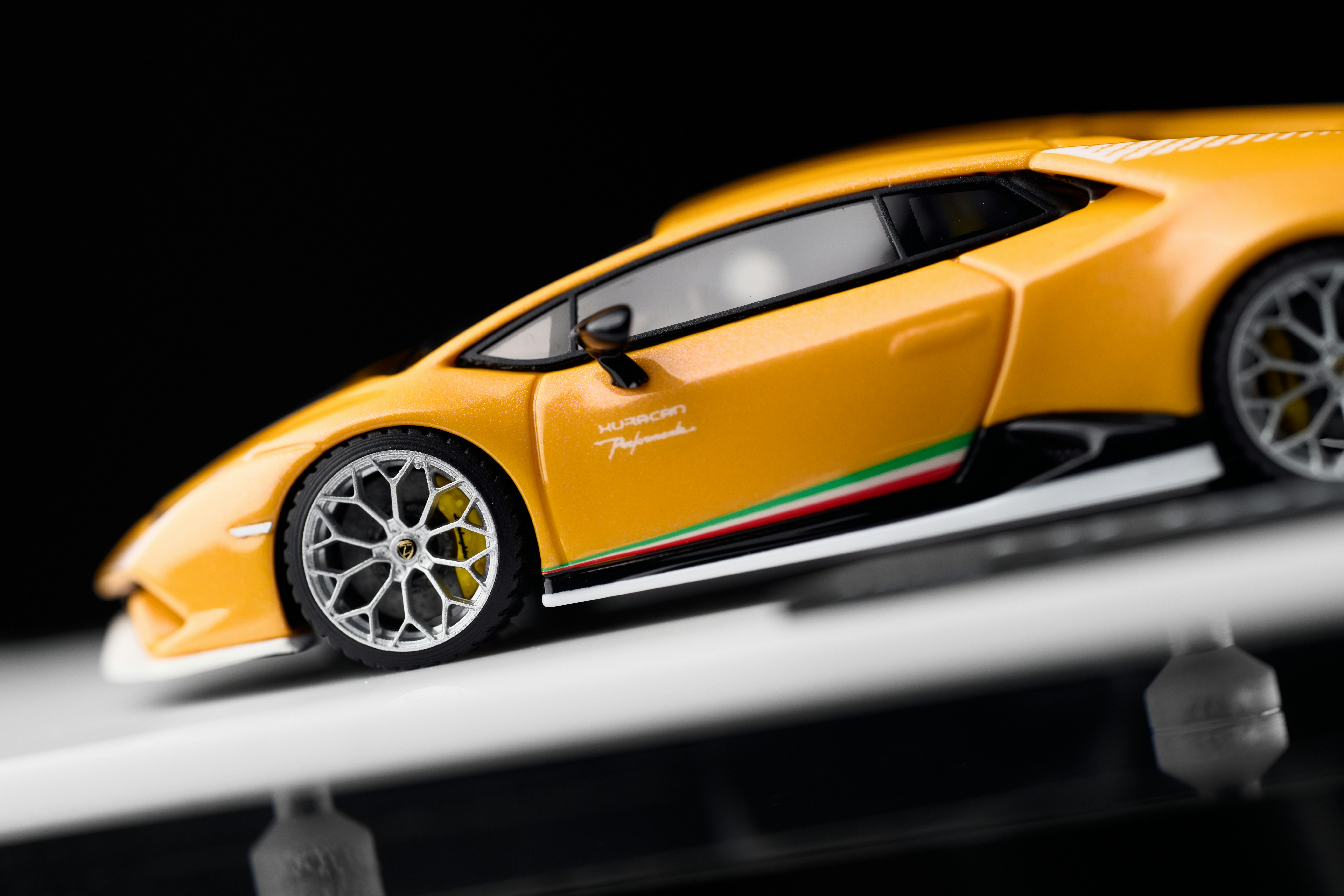 Side view of a yellow lamborghini model car