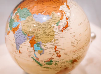 A detailed world globe showing the continent of asia