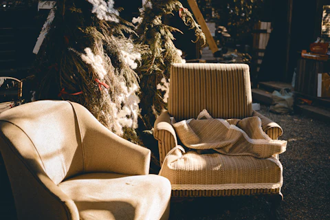 Two old upholstered armchairs in the sunlight