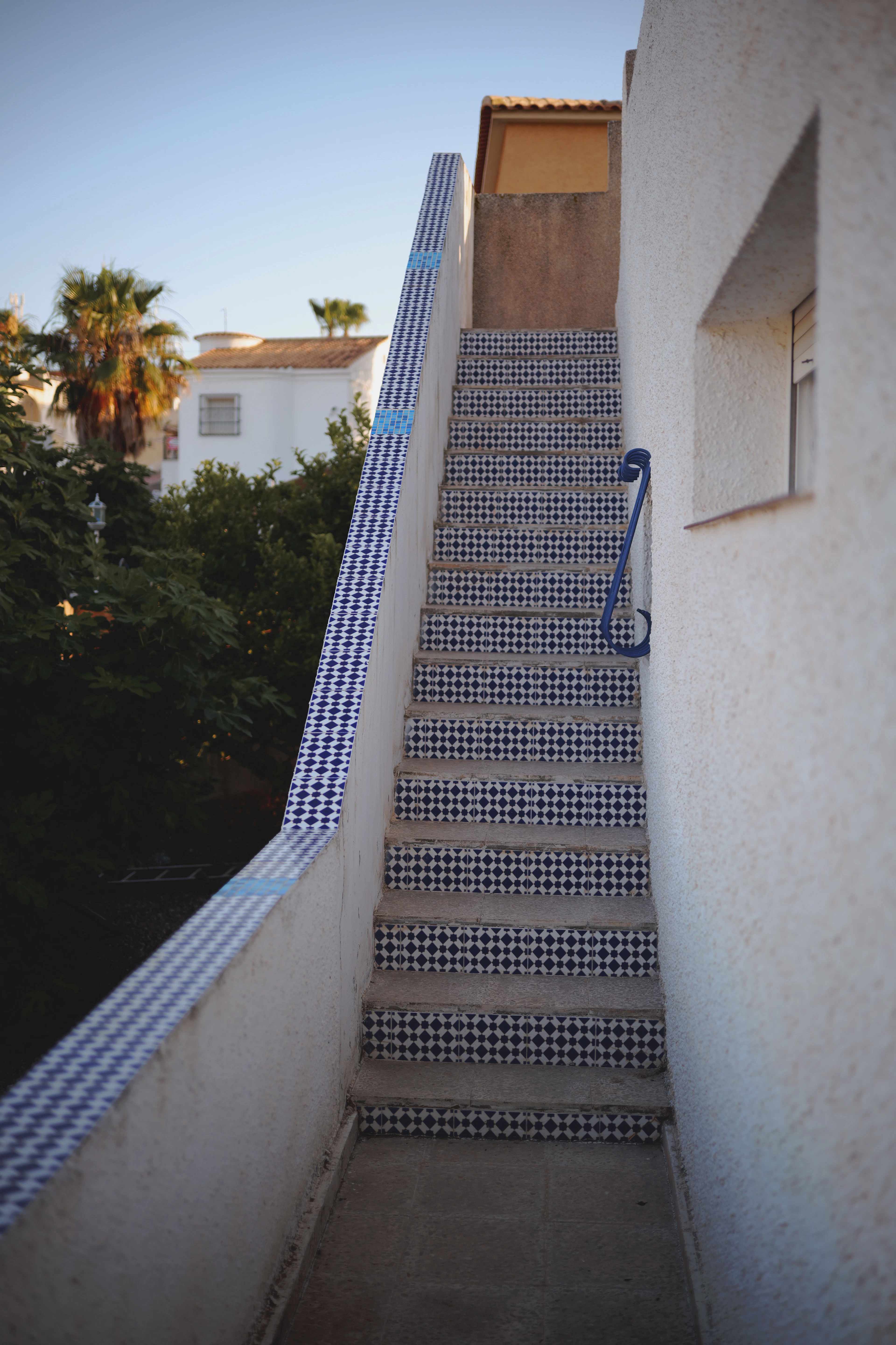 Blue and white tiled steps