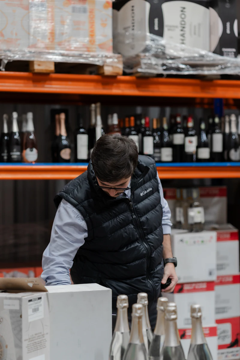 Staff member checking stock on shelves