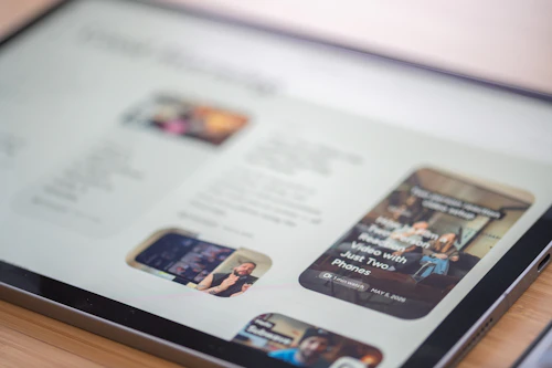 A tablet displaying a website with images and text content