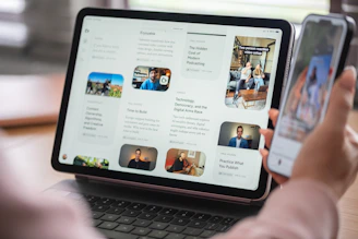 Person viewing content on a tablet and smartphone simultaneously