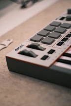 Akai midi keyboard controller with pads and knobs.