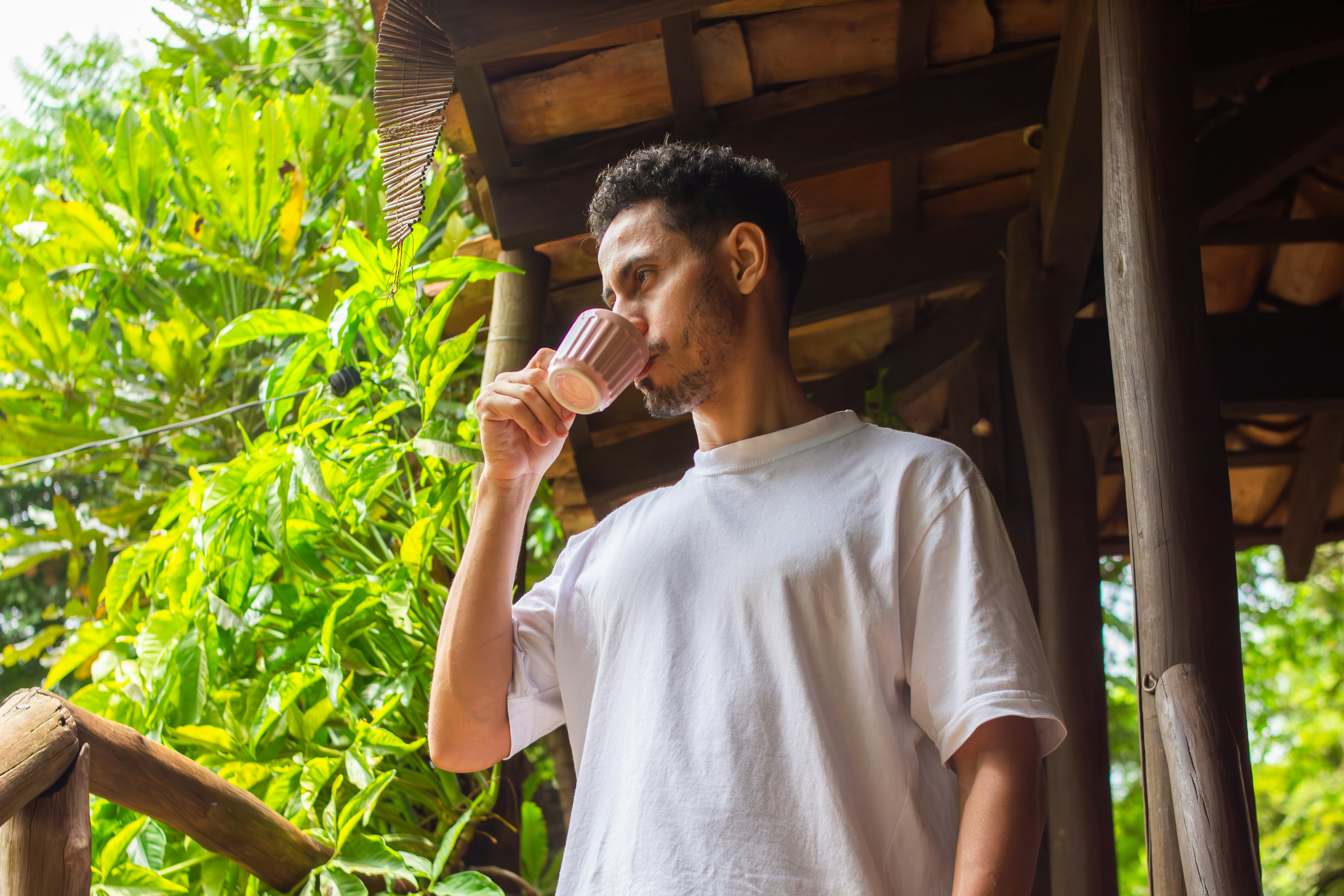 person drinking water hot weather outdoors