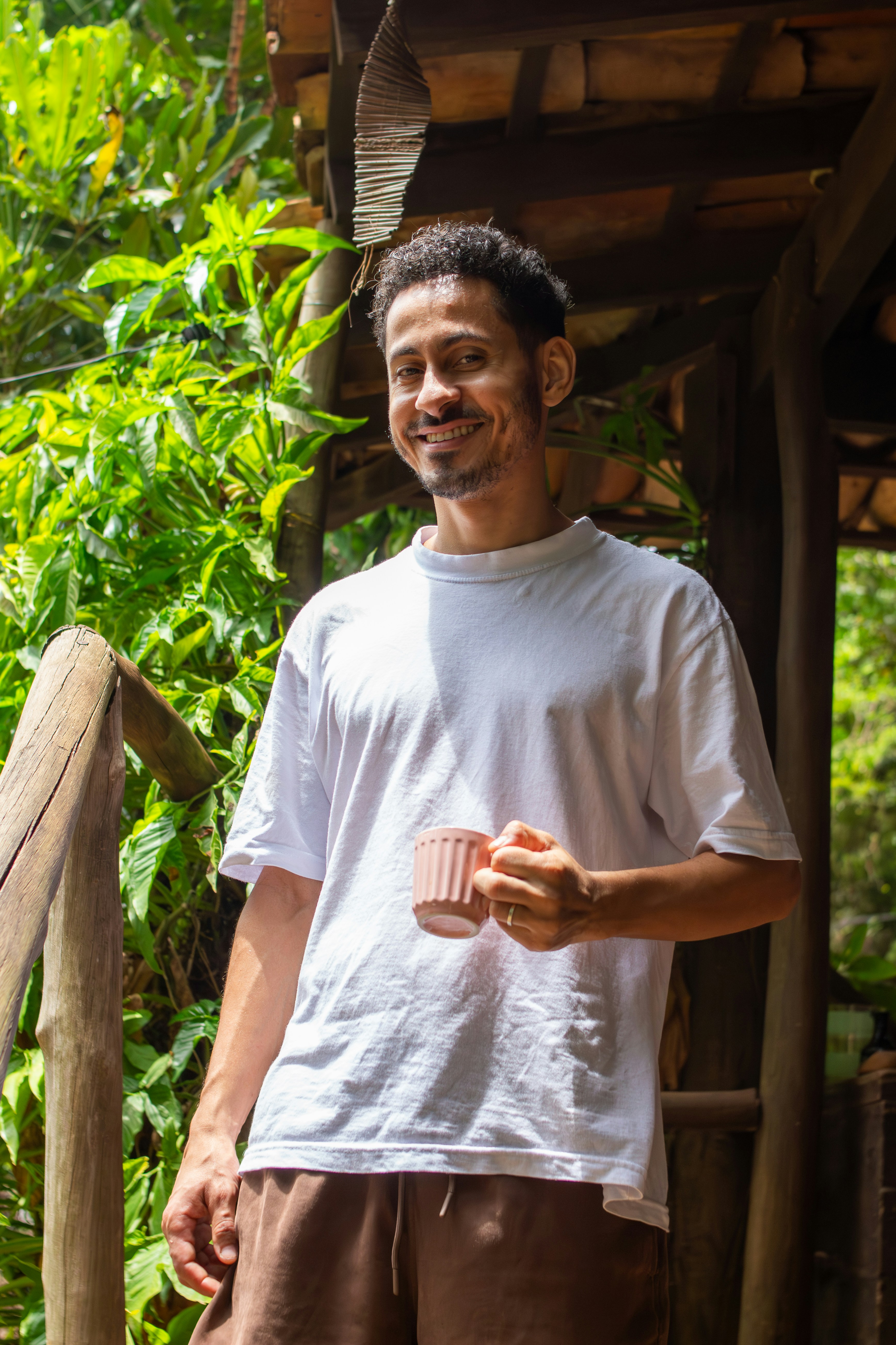 Person enjoying herbal tea in a serene setting