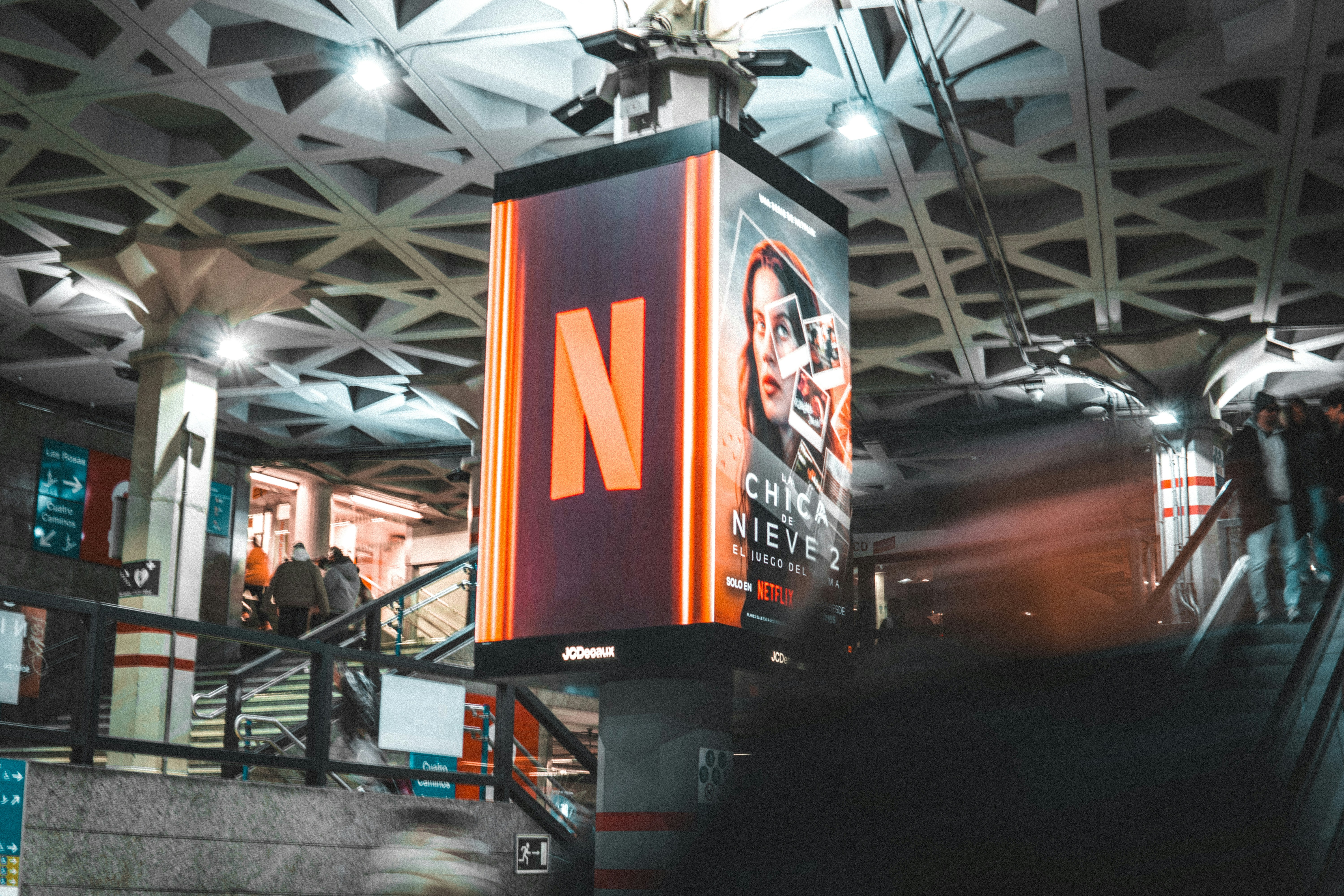 A large netflix sign hangs in a public space.