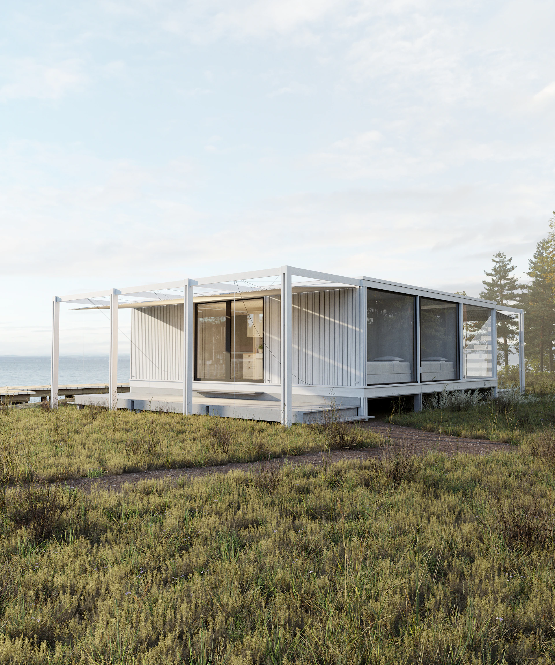 Modern white house with large windows overlooking the ocean