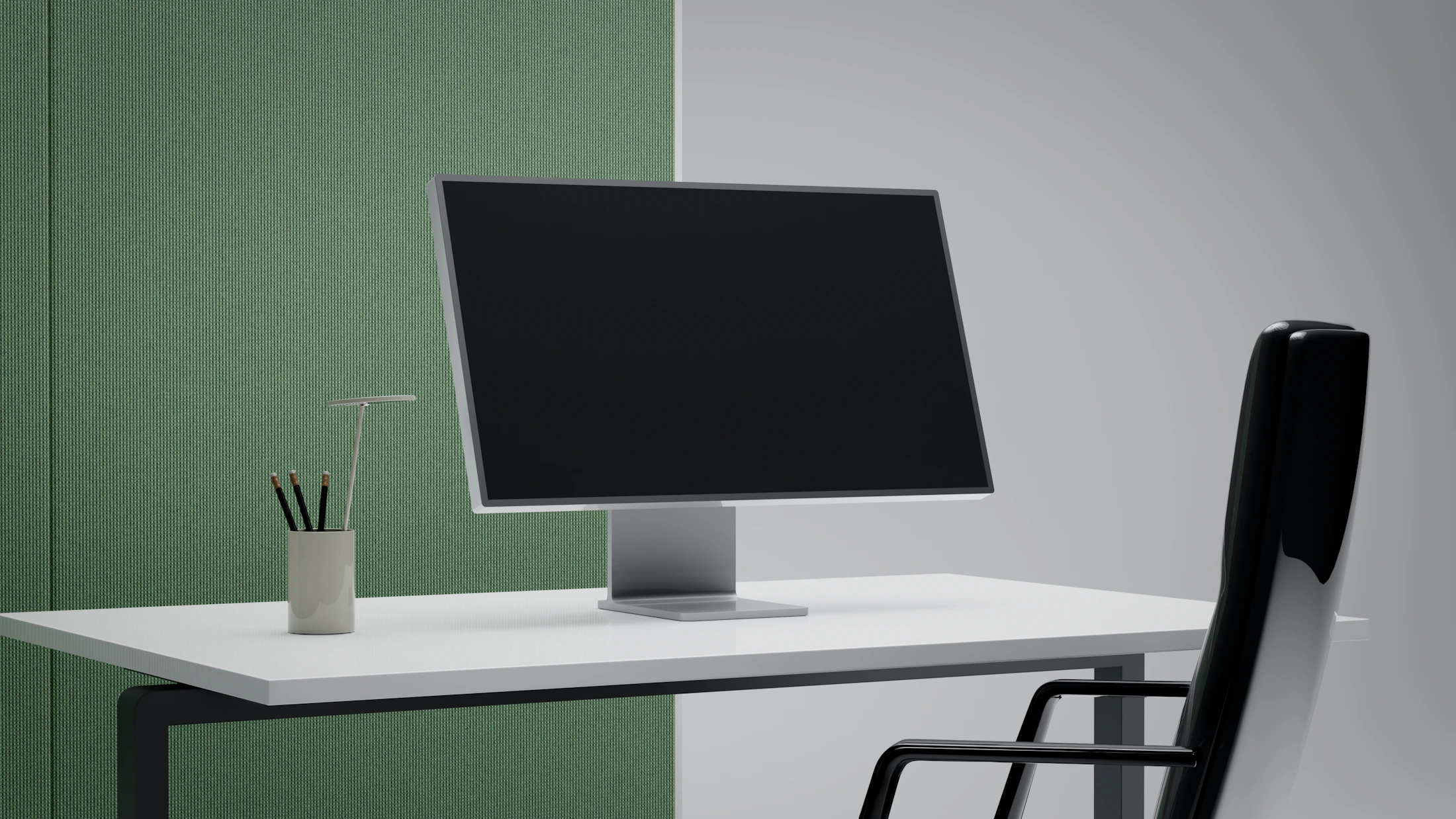 Minimal modern office desk with computer monitor and ergonomic chair