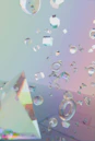 Clear geometric shapes floating on a pastel gradient background.