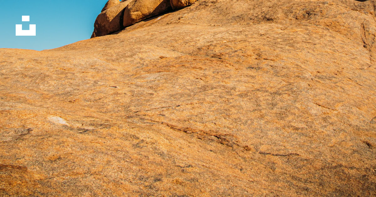 Massive rock formations under a clear blue sky. photo – Free Stone ...