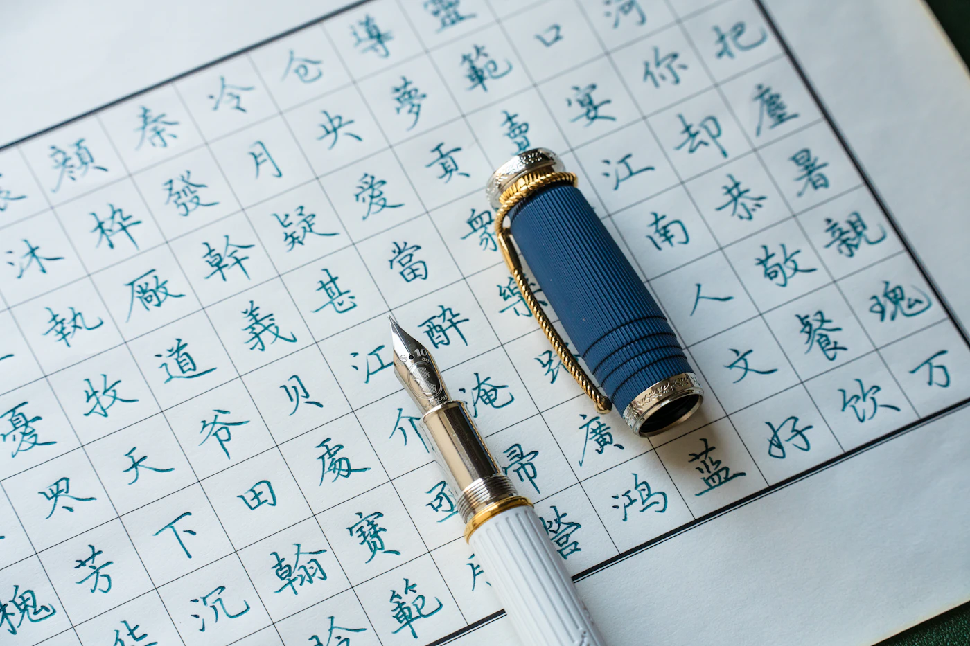 How to make your own wedding signage with calligraphy — Close-up of calligraphy pens and ink arranged on a craft table.