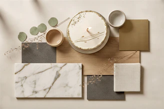 A cake with a candle surrounded by neutral material samples