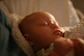 Peaceful baby sleeping soundly, bathed in warm light